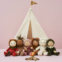 Six Dinky Dinkums Forest Friends soft dolls gathered around a pretend campfire in front of a cream teepee, including Allie Acorn from Olli Ella