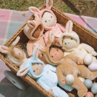 A soft, cuddly plush bunny toy with a baby blue-colored coat, perfect for small hands and imaginative play. Perfectly weighted and collectable easter-themed plush toy.