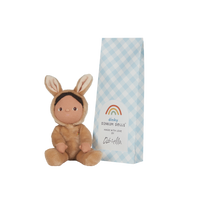 Small tan bunny plush doll with long ears beside a blue and white checkered Dinky Dinkums gift box, featuring a rainbow logo and handwritten style label