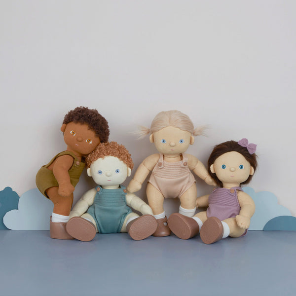 Brown afro haired, posable doll for kids. Snuggle them, dress them up and style their hair. Each Doll comes with its own removable gender-neutral outfit, socks, nappy, and shoes, perfect for interactive doll play.