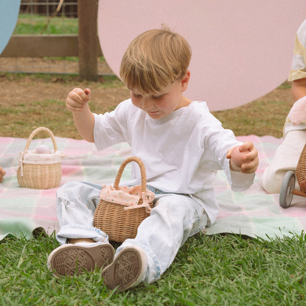 Easter themed handwoven rattan basket with printed fabric lining. Designed for kids to carry their favourite toys and trinkets, forage on outdoor adventures or as a home décor storage solution.