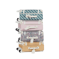 Stylish kids travel suitcase in blue striped design. Perfect for kids' travel, featuring a durable, lightweight build and eco-friendly materials. Made from recycled plastic bottles.