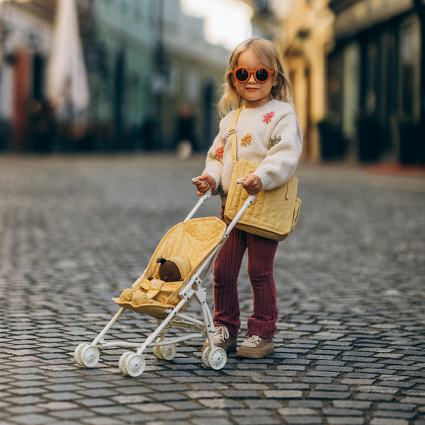 Olli Ella yellow doll pram for imaginative doll play. play with our posable dinkum dolls and matching change mat and bag for kids doll play.