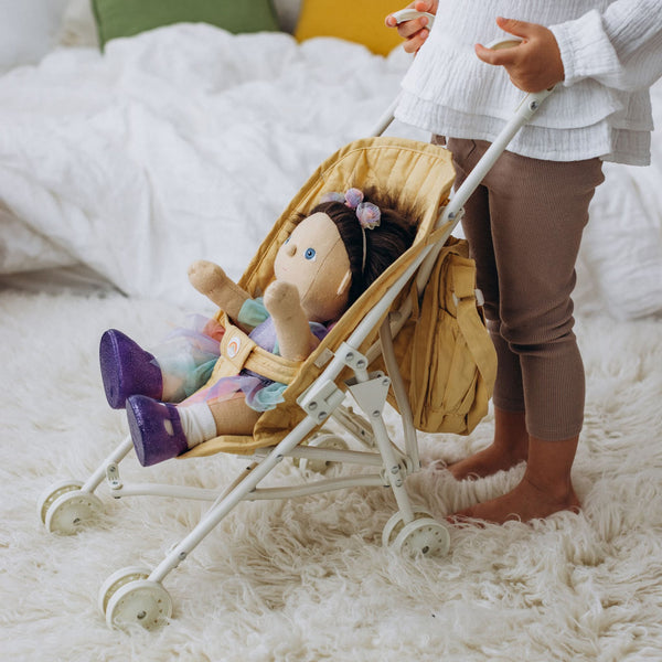 Olli Ella yellow doll pram for imaginative doll play.