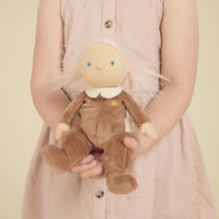 A limited-edition palm-sized plush toy, perfectly weighted in all the right places, and outfitted in a snuggly plush velvety Coconut suit.
