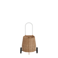 Natural rattan wheeled basket with a white handle and two black wheels, suitable for toddlers to carry toys and treasured belongings.