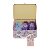 Open floral suitcase containing a pastel tulle tutu and purple glitter shoes from the Dinkum Dolls Fairy Pretend Pack for doll dress up play