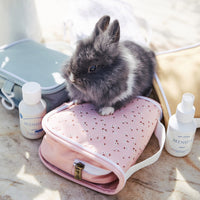 Pink daisy printed kids travel toiletry bag. Functional wash bag for kids sleepovers, school camps, daycare and holidays.